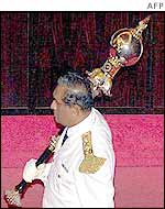 Parliament official carries the ceremonial mace