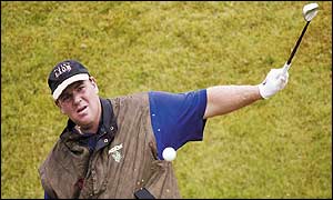 John Daly lays a one-handed chip during practice for The Open last week