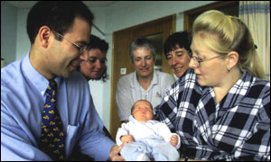 Dr Javaid and new mother and baby