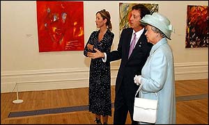 Heather Mills and Sir Paul McCartney showing the Queen Sir Paul's works