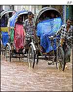 Rickshaws struggle against floods in Dhaka, Bangladesh