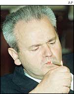 Slobodan Milosevic smoking a cigar