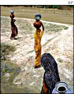 Women at a dry water well in Rajasthan