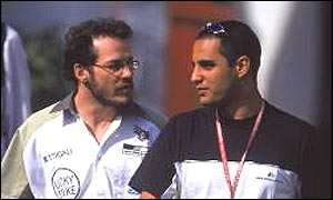 Jacques Villeneuve and Juan Pablo Montoya chat in the Formula One paddock