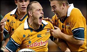 Stirling Mortlock celebrates his try with Chris Latham and Peremy Paul
