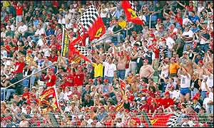 Fans cheer on their hero Michael Schumacher at Hockenheim, a track that he has never won on
