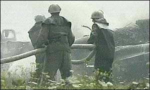 Fire fighters by the wreckage