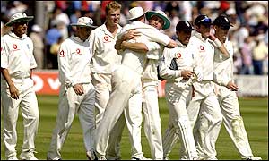 England are united in celebration after ending India's innings