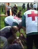 Rescue workers attending an injured man