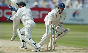 Alec Stewart is stumped by India wicketkeeper Ajay Ratra