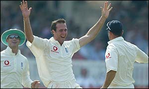 Michael Vaughan celebrates with Nasser Hussain after the dismissal of Nasser Hussain