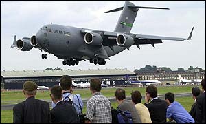 DA Boeing C-17 Transport plane lands over spectators 