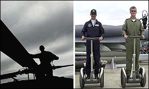Pilot looks over the blades of the Black Hawk while Eurofighter Pilots Chris Smith (right) and Chris Worning try the transporters