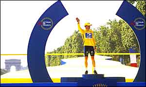 Lance Armstrong poses on the podium in Paris after winning the Tour de France