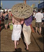 Festival goers with a parasol