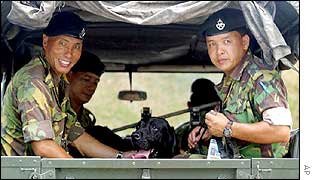 Brunei soldiers and sniffer dog