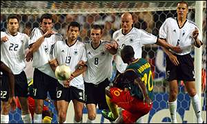 Patrick Mboma takes a free kick against Germany