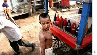 Boy selling drinks AP