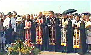 Priests lead a ceremony at the crash site