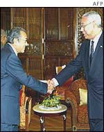 Colin Powell (right) with Malaysian Prime Minister Mahathir Mohamad