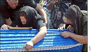Relatives of one of the killed during the funeral ceremony at a Lviv cemetery