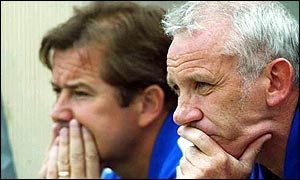 Reid (right) and assistant Adrian Heath watch their team play Amiens