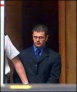 Ian Metcalfe with police