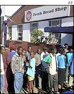 People queuing for food in Zimbabwe
