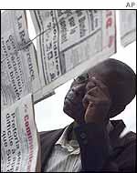 Kinshasa resident reading the newspaper
