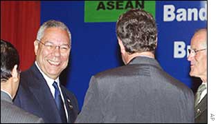 Colin Powell with fellow delegates at the meeting