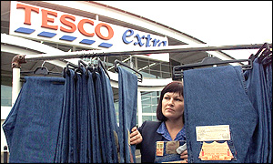 A Tesco shop assistant with Levis jeans at a Tesco store in Newcastle