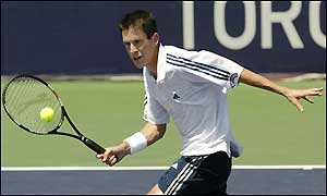 Tim Henman of Great Britain rushes the net against James Blake in the second round of the Tennis Masters Toronto 