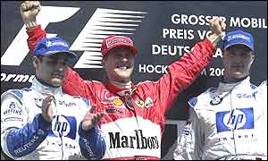 Juan Pablo Montoya, Michael Schumacher and Ralf Schumacher on the podium for the Grman Grand Prix