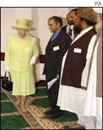 The Queen removed her shoes in accordance with the Muslim religion