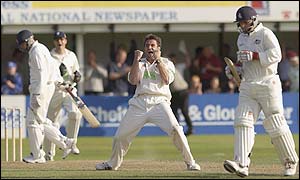 Somerset's Steffan Jones celebrates taking the final wicket of Mark Ealham