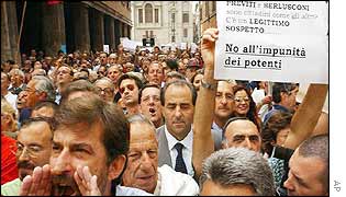 Crowds outside the Senate; placard reads: 