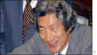 Japanese Prime Minister Junichiro Koizumi smiling at the end of the year's Diet session
