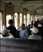 Passengers on steam train