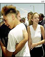 Friends of one of the victims celebrate her release