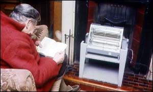 Pensioner huddles in the cold