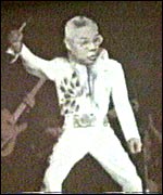 Colin Powell as Elvis