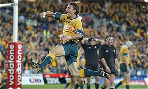 Mat Rogers celebrates scoring for Australia