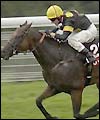 14-1 shot Bond Boy ridden by Chris Catlin wins the Stewards' Cup