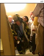 Fireman running up World Trade Center stairs