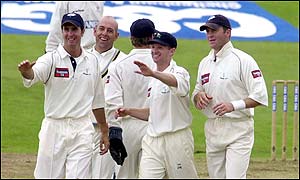 White (second right) took the key wicket of Stewart with the Surrey man on three runs