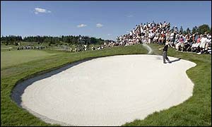 Former USPGA champion Jeff Sluman tackles a bunker on the tenth