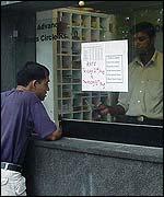Man buying cinema ticket