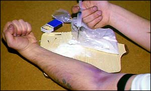 A drug addict injecting