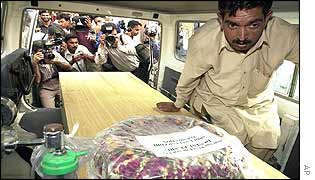 Coffin loaded on to ambulance in Pakistan