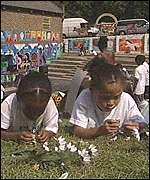 children making daisy chains